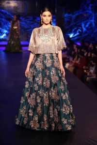 Teal green embroidered Lehnga Skirt and loose crop top from Manish Malhotra