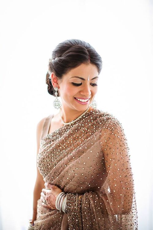 Pastel brown net saree with  LAVÈ by Anagha Venu  Facebook