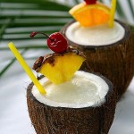 Summer cocktails served in coconut shell