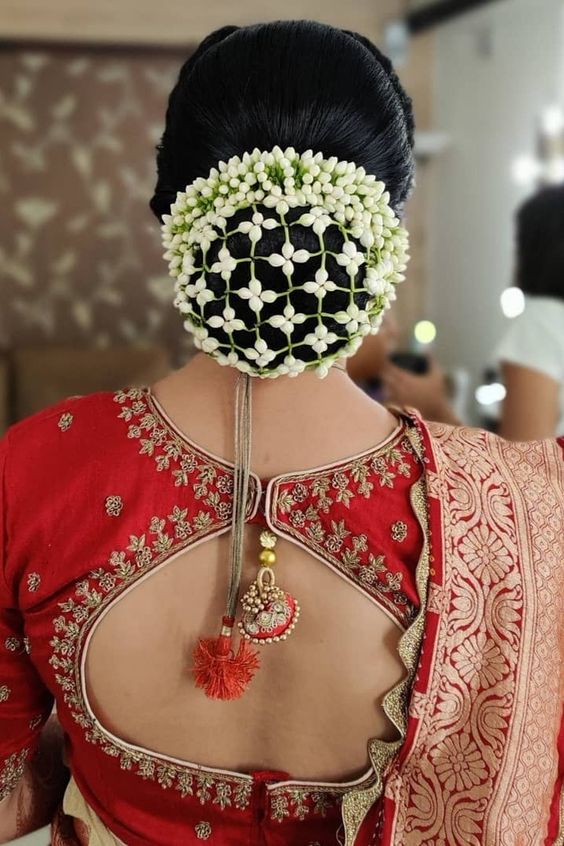 Top 15 Floral Bun Hairstyles for Brides this Wedding Season - K4 Fashion |  Beautiful wedding hair, Floral accessories hair, Bridal hair inspiration
