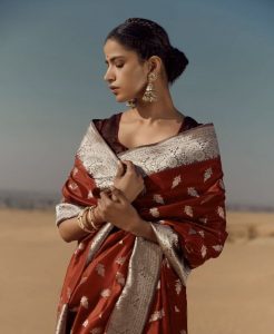 Wear earrings with the saree and give neckpiece a miss
