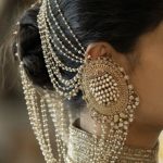 Bold earrings with bun hairstyle-Threads-WeRIndia