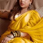 Woman in mustard yellow saree in summer 2026