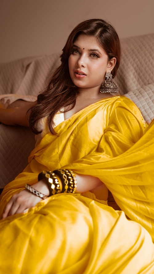 Woman in mustard yellow saree in summer 2026